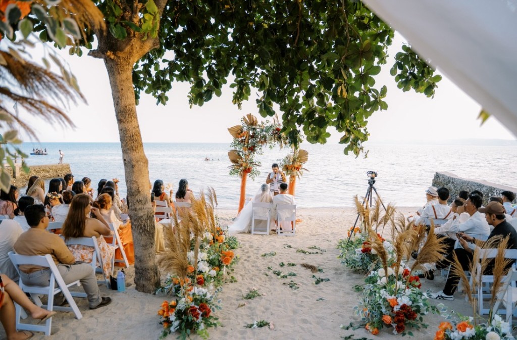     Romantic sunset beach wedding ceremony in Batangas Rust Orange Theme Set Up